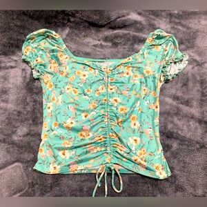Mint green floral adjustable crop top in the size small
